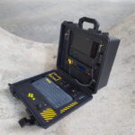 A military-looking cyberdeck with a built-in Geiger counter