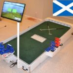 Playing Connect Four against a mini golfing AI opponent