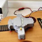 AutoStrummer is a DIY device that strums your guitar for you