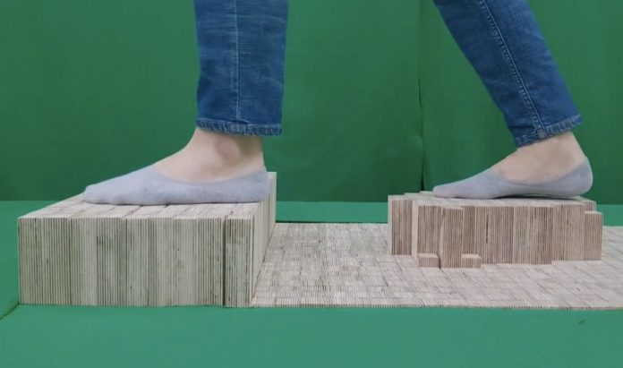 Elevate is a walkable pin array floor that generates shape-changing terrains for VR