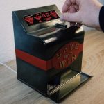 Slot machine piggy bank makes saving your coins more fun