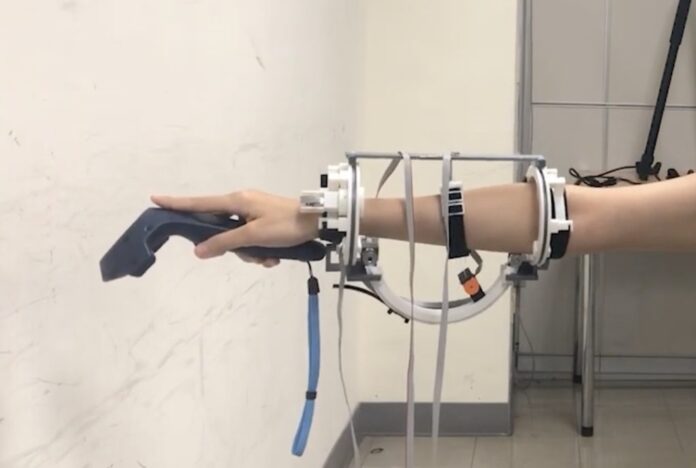 This arm-mounted contraption provides guidance in VR