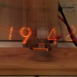 This pendulum POV clock uses a Nixie tube to plot the time as it swings