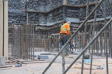 Rebar being tied together by hands