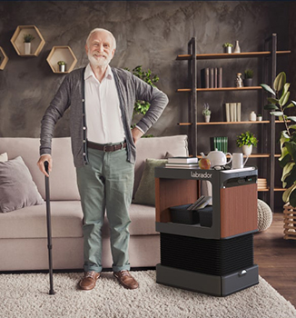 Man standing beside an home robot