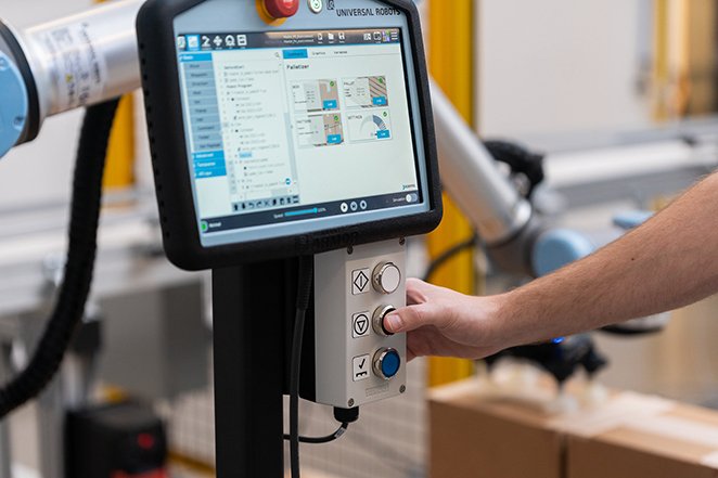 Hyperedge- , PCB Design, Hardware Design, Electronics Design, Worker using the Robotiq Palletizing Solution PE Series to accomplish material handling task