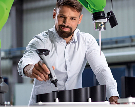 Worker working in collaboration with a robot
