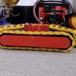 Can a triangle of tank tracks outperform omni wheels?