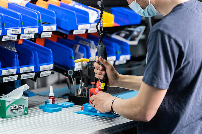 Hyperedge- , PCB Design, Hardware Design, Electronics Design, Worker fastening screws with a manual screwdriver