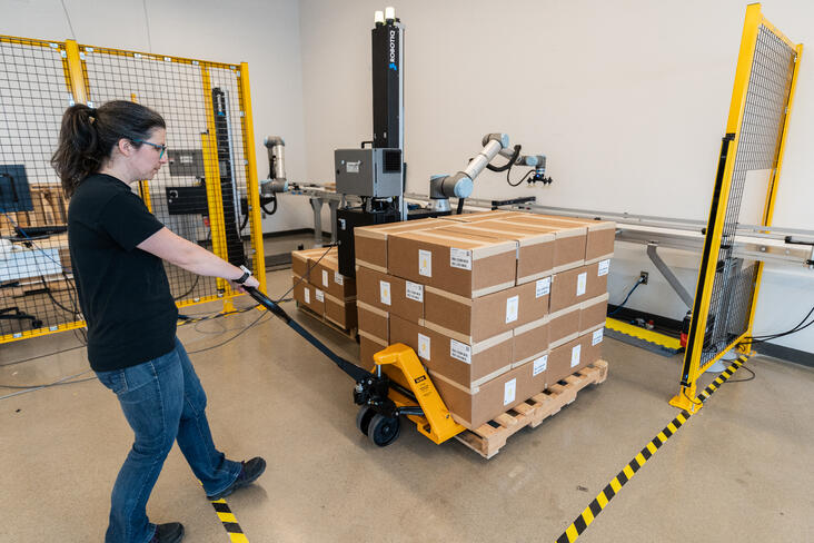 Hyperedge- , PCB Design, Hardware Design, Electronics Design, Worker bringing a pallet near a palletizing robot.