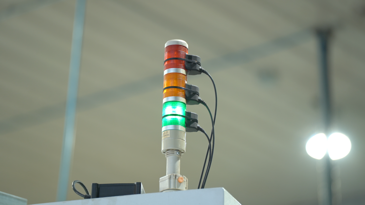 Machine Tending Solution including a stack light sensor to detect machine's status