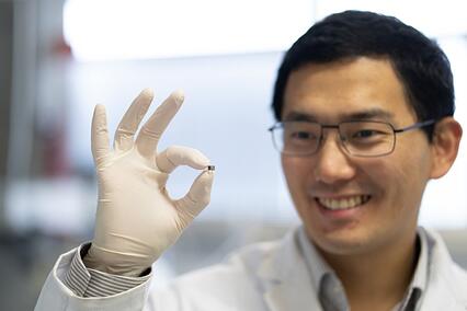 Hyperedge- , PCB Design, Hardware Design, Electronics Design, Person holding a micro robot