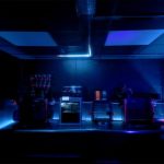 A pair of Arduino UNO R4 boards power this Tron-inspired, decked-out shop room