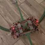 This miniature monorail stays upright with the help of gyro stabilization