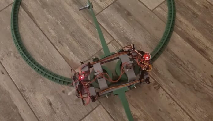 This miniature monorail stays upright with the help of gyro stabilization